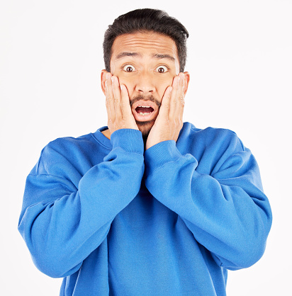 Scared, wow and portrait of asian man with surprise in studio for gossip, fear or crazy drama on white background. Omg, wtf and face of male model with expression for terror, horror emoji or bad news