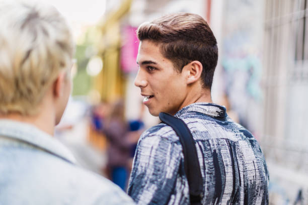 istock Gay couple walking around 1573704115