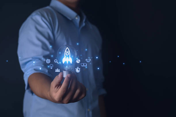 istock businessman showing rocket icon 1573716856