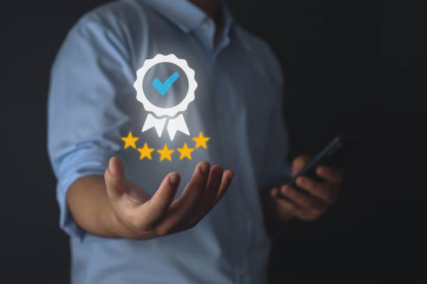 istock Quality Assurance from here guarantees quality on business people's hands. 1573717891