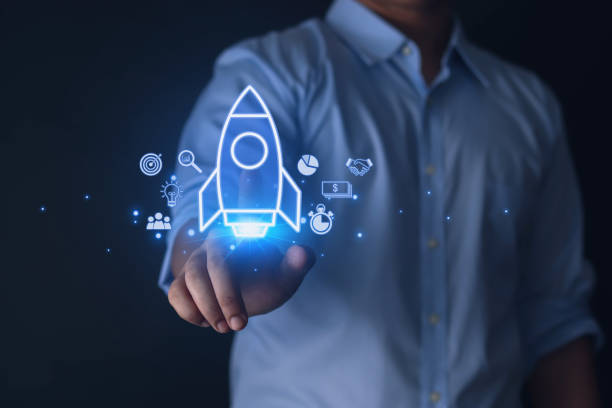 istock Businessman pointing at rocket icon 1573718453