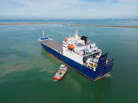 Aerial drone view above cargo vessel.Professional business logistics and transportation of cargo ship.