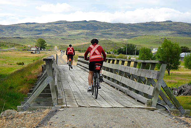 Two cyclists crossing the airport bridge in Duesseldorf north