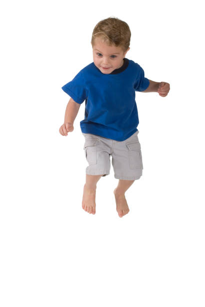 istock Happy Toddler Boy Jumping 157372980
