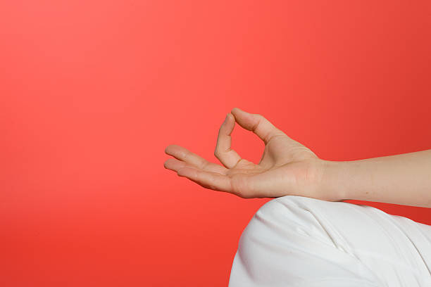Close up of hand in lotus pose stock photo