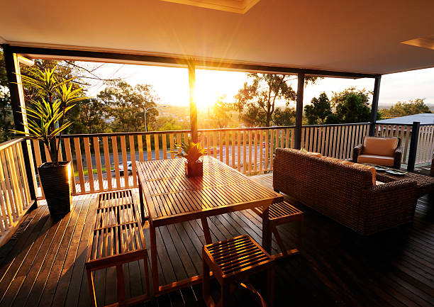 veranda bei sonnenuntergang - golden bamboo stock-fotos und bilder