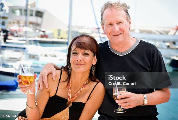 Happy Wealthy Mature Couple By The Sea Stock Photo - Download Image Now - 50-54 Years, Brown Hair, Men