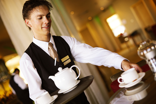 Waiter serving Tea