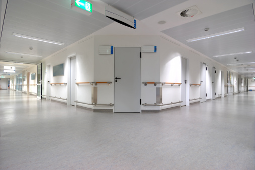 Empty doctors office with medical equipment and instruments. Nobody in cabinet used by physician to examine patients at checkup visit appointment. Workplace for health care consultation.