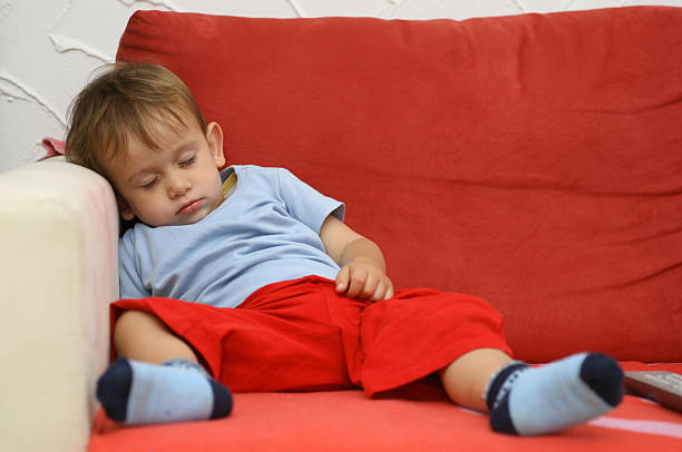 istock Couchpotatoe - lazy boy taking a nap on the couch 157373610