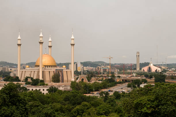 abuja city of gemischte religion - nigeria stock-fotos und bilder