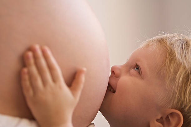 Pregnant Woman with Newborn baby in her Belly