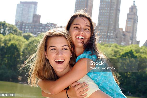Piggyback Friends Stock Photo - Download Image Now - Friendship, Central Park - Manhattan, Adolescence