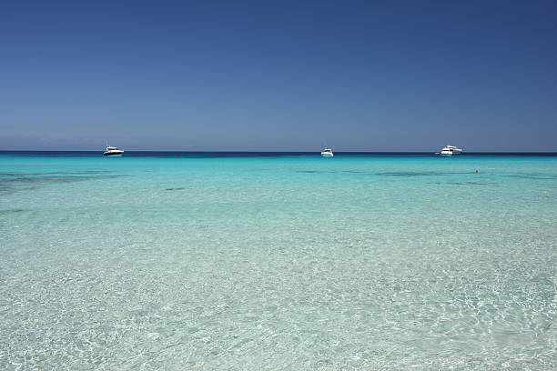 istock turquoise mediterranean sea and yachts 157374774