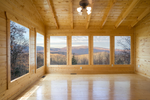 A majestic view of the Smoky Mountains awaits the buyer of this Log Cabin.