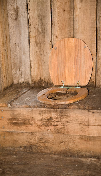 inside the old outhouse  outhouse interior stock pictures, royalty-free photos & images