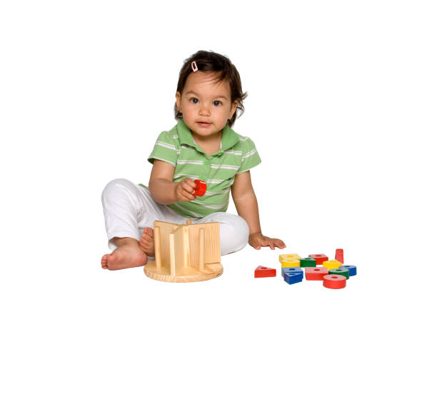 Close up of wooden multicolor bead toy connected by strings.