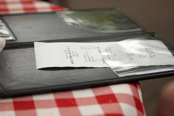 Restaurant check on patterned cloth stock photo