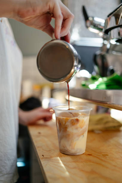 istock Barista preparing iced latte 1573753277