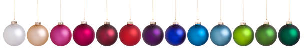 Colorful Christmas Baubles Hanging in a Row Isolated on White. stock photo