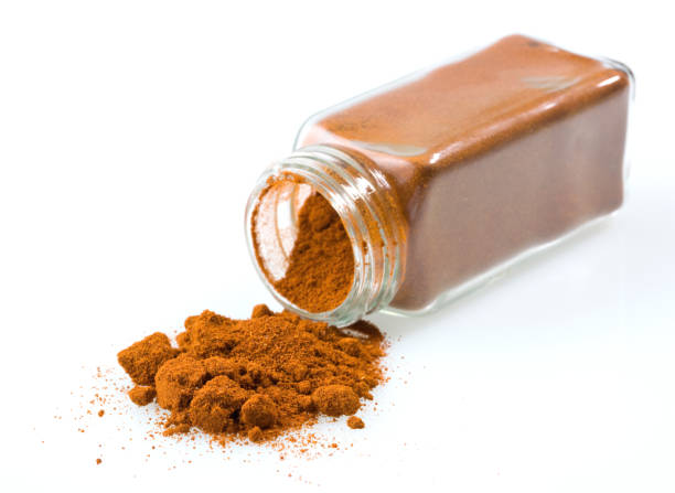 A food background with spices on a white table