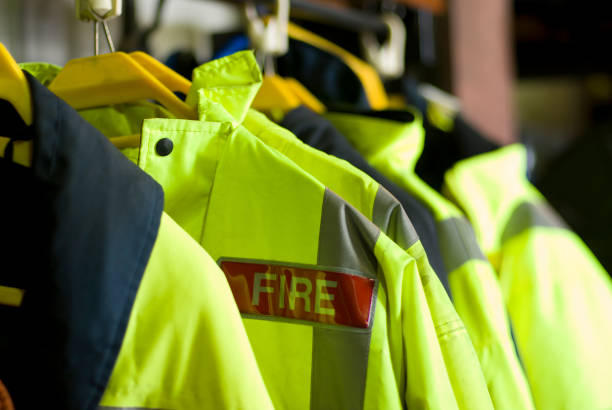 istock A row of British Firefighter jackets neatly hung up for use 157375815