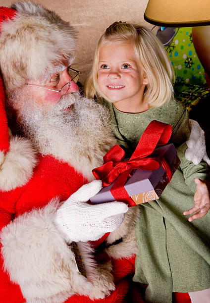 istock Beautiful little girl gets a gift from Santa 157375904