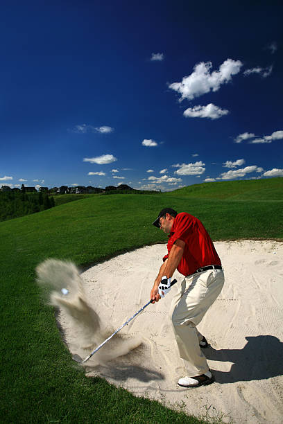 istock Caucasian Male Goler Hitting Bunker Shot 157375928