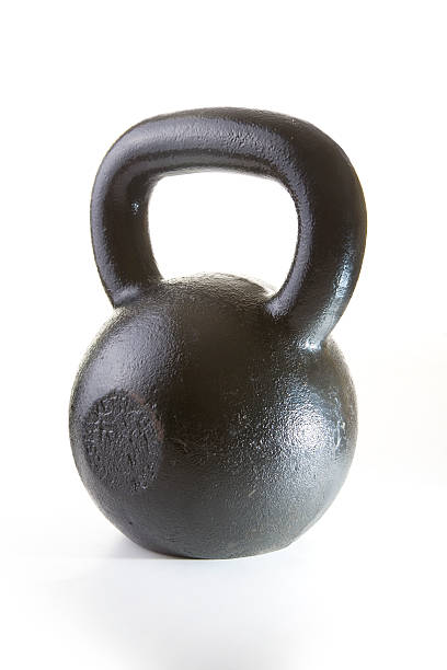 Kettlebell A 35lb kettlebell - a piece of weight training equipment - isolated on white. kettlebell stock pictures, royalty-free photos & images
