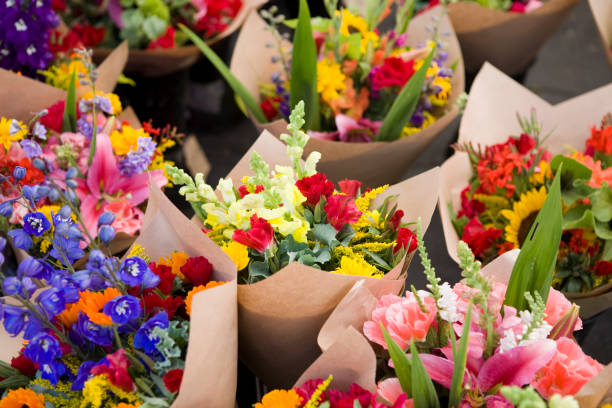 A stunning assortment of vibrant floral bouquets featuring peonies, roses, and hydrangeas in various colors. perfect for special occasions and adding a touch of nature's beauty.