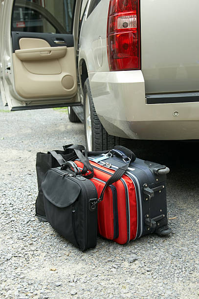 istock Suitcases by open door of SUV 157376076