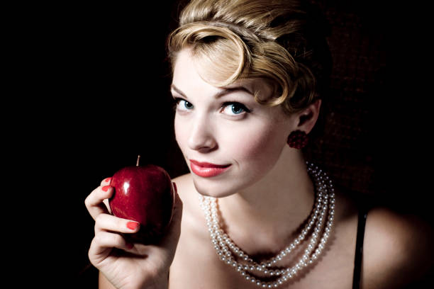 young girl with a red apple
