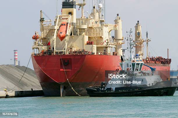 Cargo Ship And Tugboat Stock Photo - Download Image Now - Nautical Vessel, Pulling, Red