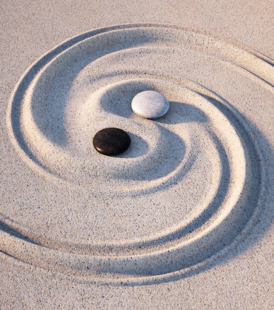istock Yin Yang symbol of stones and sand 1573764521