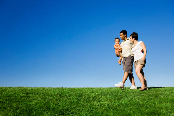 istock Family Strolling in Park 157376734