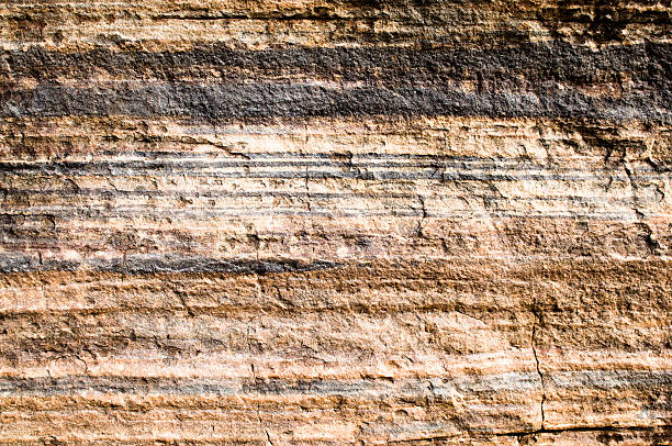 Geological Layers An Australian cliff face showing rock strata. ancient history stock pictures, royalty-free photos & images