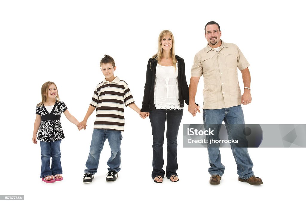 Familia de cuatro agarrar de la mano - Foto de stock de Familia libre de derechos