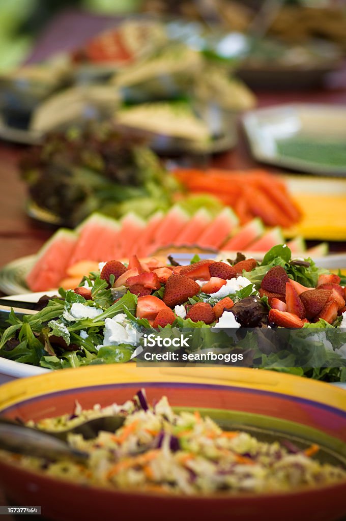 Salads at Outdoor Catering Buffet Salads at an outdoor catering buffet with selective focus and room for copy. Barbecue - Meal Stock Photo