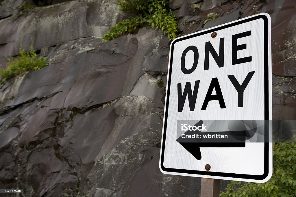 One way sign with rock wall (XXL)  One Way Stock Photo