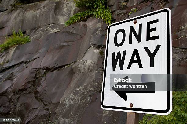 One Way Sign With Rock Wall Stock Photo - Download Image Now - One Way, Advice, Arrow Symbol