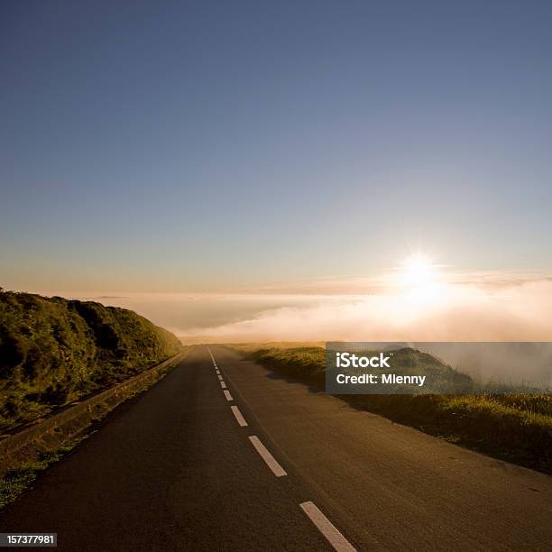 Country Highway Into Clouds During Sunset Stock Photo - Download Image Now - Eternity, Highway, Road