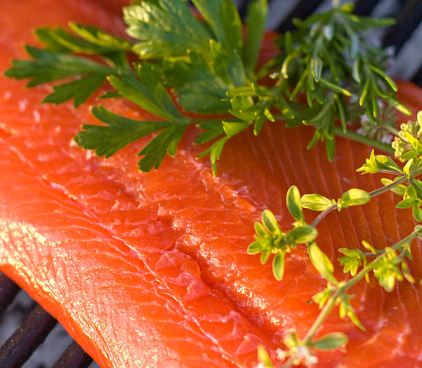 Cooking Fresh Seafood, Raw Sockeye Salmon Fish Fillet & Barbeque Grill  sockeye salmon filet stock pictures, royalty-free photos & images