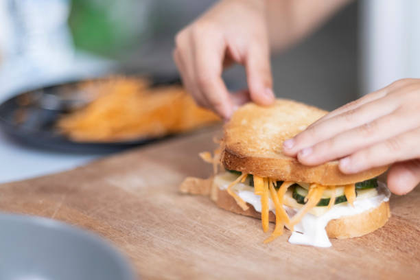 istock Child makes healthy tasty sandwich 1573782747