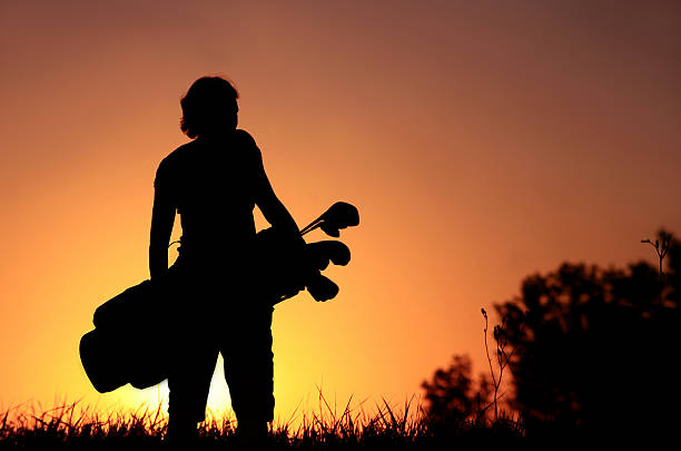 Woman Golf Silhouette  night golf stock pictures, royalty-free photos & images