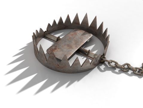 A rusty old bear trap with a strong shadow. Very high resolution 3D render.