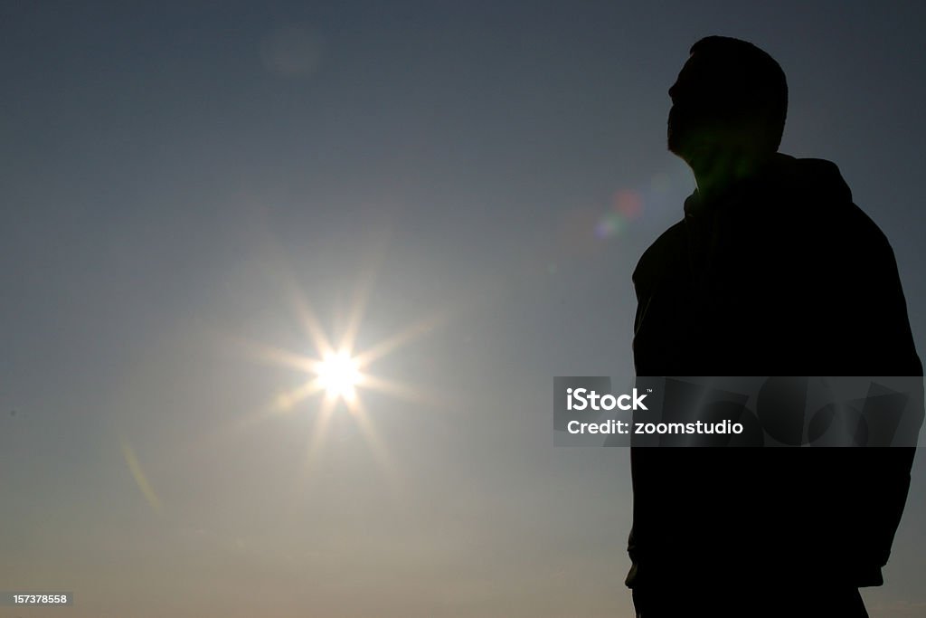 Silueta del hombre y de sol - Foto de stock de Adulto libre de derechos