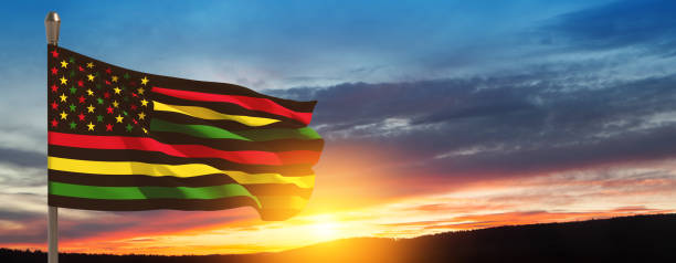 istock Alternative Juneteenth Flag on flagpole with sunrise or sunset. Since 1865. Banner. 1573788565