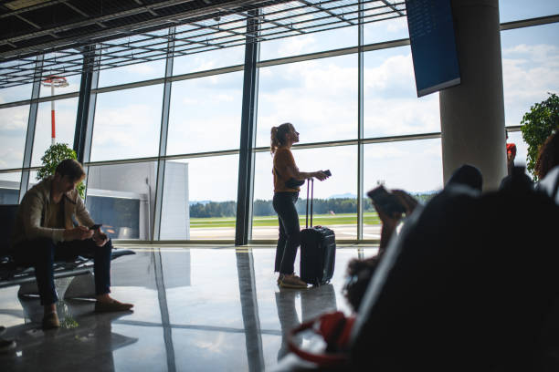istock People Waiting At Departures Terminal 1573789125
