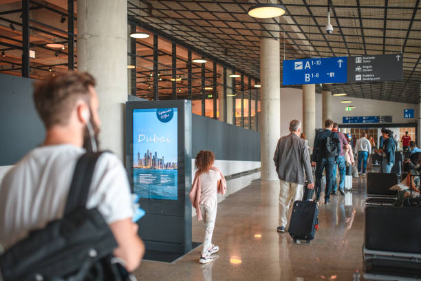 istock Diverse People Heading To Boarding Gates At Departures Terminal 1573789659