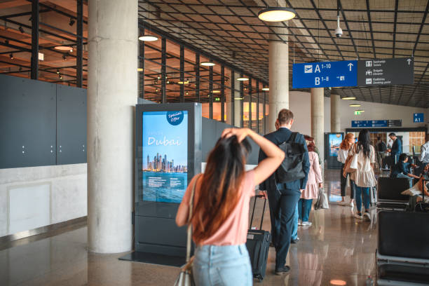 istock Diverse People Heading To Boarding Gates At Departures Terminal 1573789660